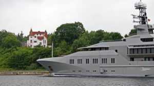 Profile of Superyacht Skat in Kiel Canal, with VIlla Hoheneck